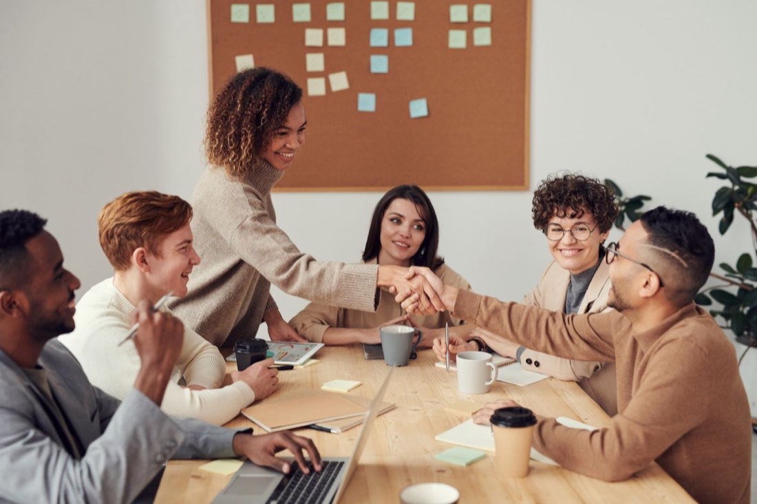 Consultants discussing business priorities in a modern office